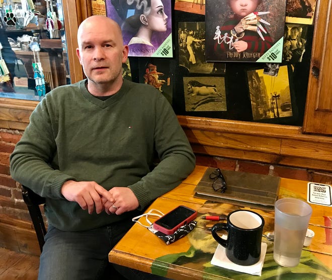 Local podcast creator Daniel Williams talks about his show "The Midnite Hour with Tom Bobbajobski" in Raven Cafe in Port Huron on March 19, 2021.